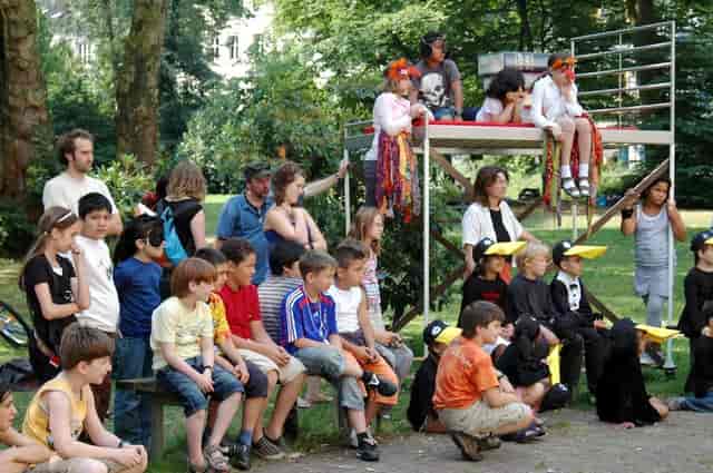 KinderKultur outdoor park stage, informal community event production.