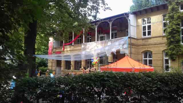 HausDrei cultural center outdoor venue with canopy tents for event hosting and site rentals.