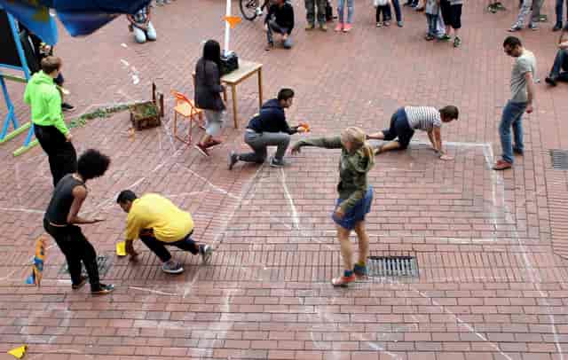 Interactive pop-up activation at HausDrei with chalk floor zones for creative event engagement.