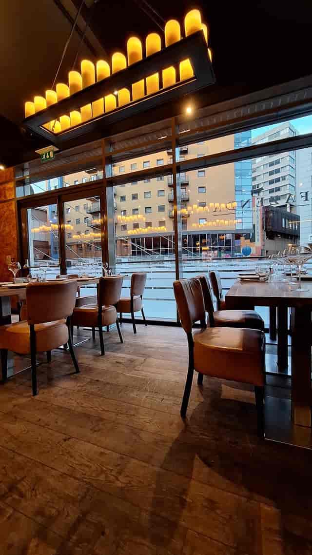 Modern Fazenda restaurant with floor-to-ceiling windows for corporate dinners and networking.