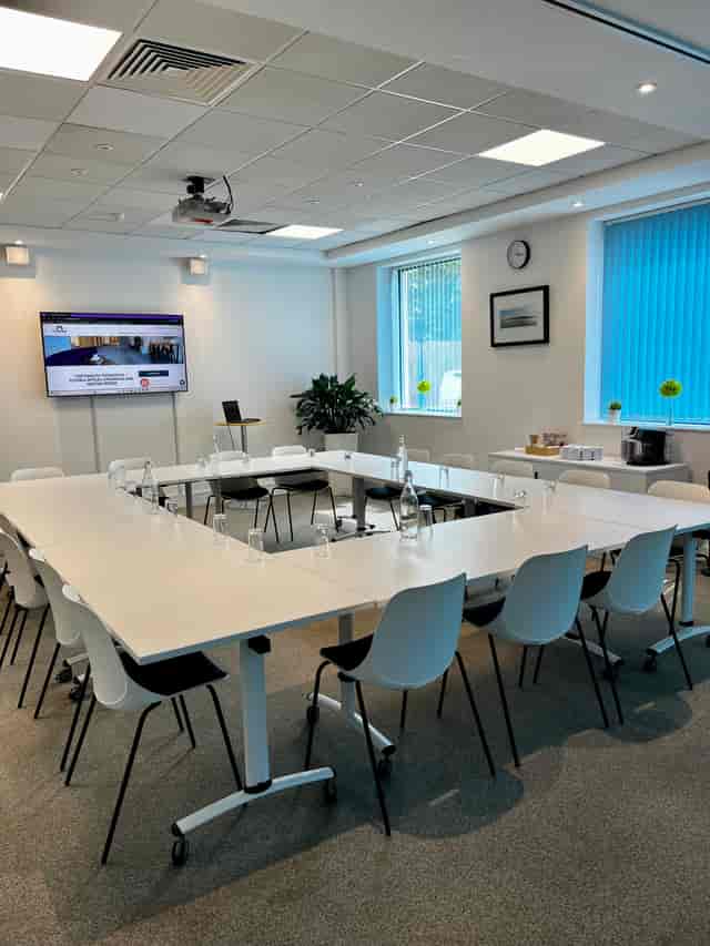 U-shaped meeting room in Portsmouth Technopole with modern AV for business conferences and workshops.