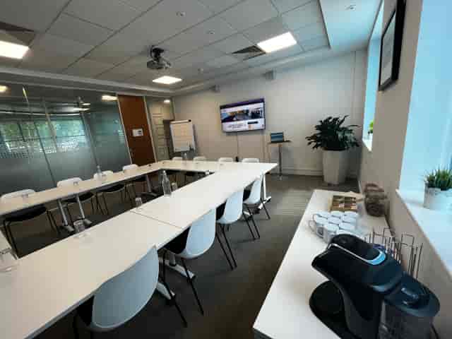 U-shaped Portsmouth meeting room with AV setup for corporate business workshops.