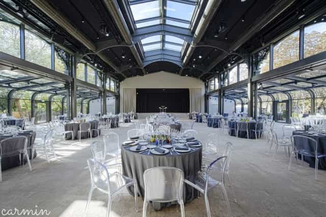 Pavillon Gabriel banquet hall with stage, ideal for luxury gala dinners and corporate events.