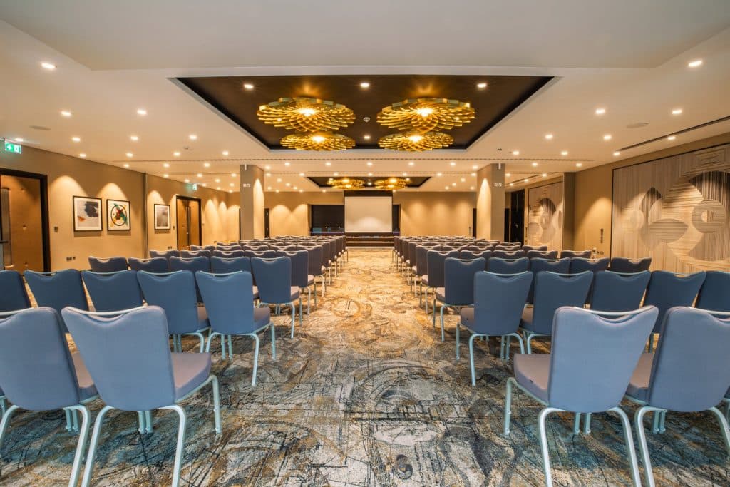 Theater-style meeting room at DoubleTree Woking for corporate presentations and workshops. - Banner