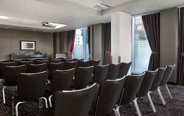 DoubleTree Woking boardroom with floor-to-ceiling windows for corporate presentations and training.