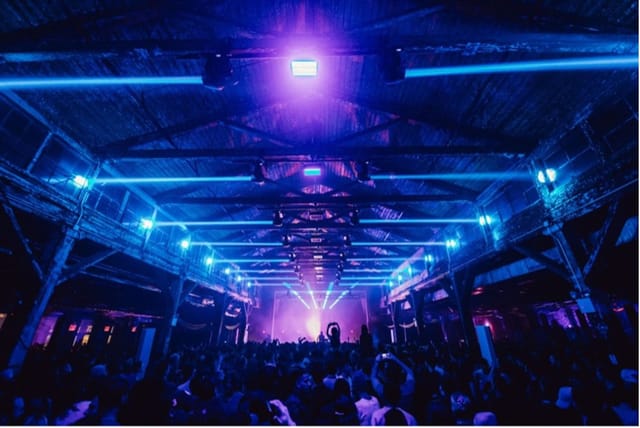Industrial basement nightclub with immersive lighting for live music events and venue hire.