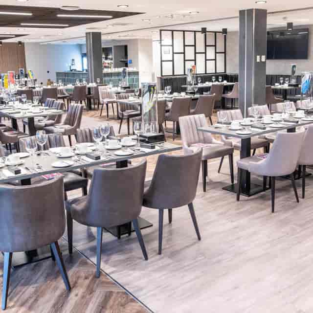 Centenary Lounge banquet room: modern dining setup for corporate events and conference catering.
