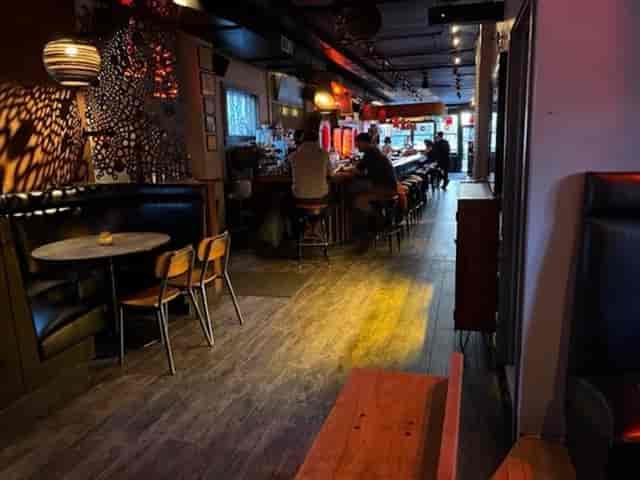 Long Room Chicago: Intimate booth seating and bar area, perfect for networking happy hour events.