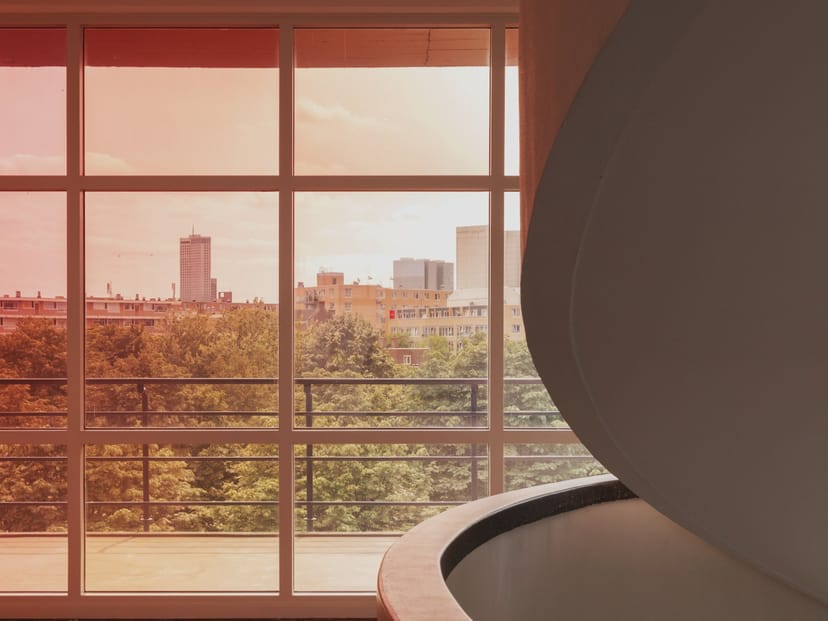 Bright breakout space with skyline views for creative brainstorming and executive workshops.