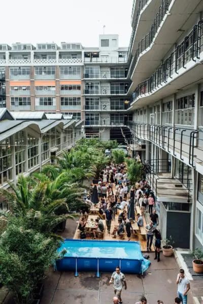 Industrial-chic courtyard venue for networking events and corporate receptions.