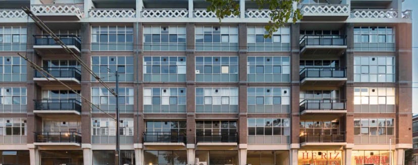 Modern industrial office space with balcony for boutique event venue or corporate meetings.