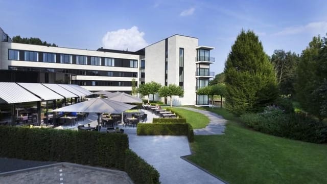 Modern hotel restaurant in Rotterdam, ideal for outdoor networking and corporate event dining.