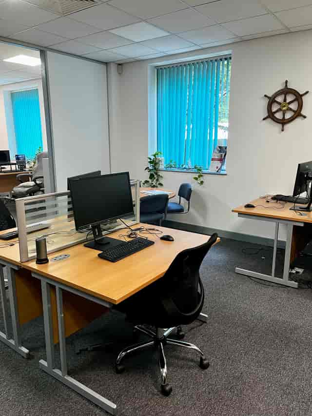 Co-working space at Portsmouth Technopole, utilitarian office for corporate meetings and workshops.