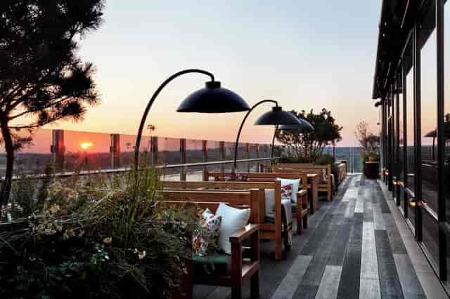 Chic Treehouse Hotel rooftop terrace for sunset cocktail receptions with stunning views.