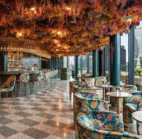 Restaurant in The Pelham with floral ceiling, ideal for upscale events and gatherings. - Banner