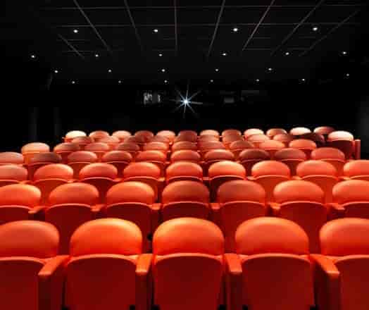 Screening room at Covent Garden Hotel with red seating, perfect for presentations and lectures.