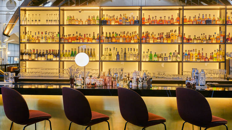 Meister Bar at German Gymnasium: vibrant spirits and sleek design for cocktail receptions. - Banner