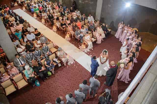 Wedding ceremony in U-shape seating layout at The Harbert Center terrace for event venue rental.