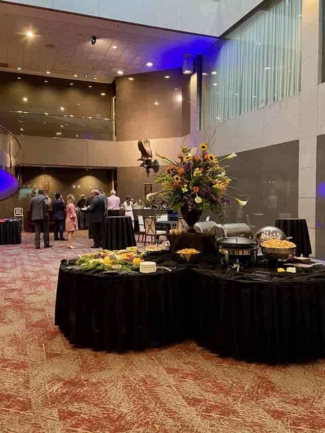 The Atrium at The Harbert Center: floral reception setup for corporate networking events.