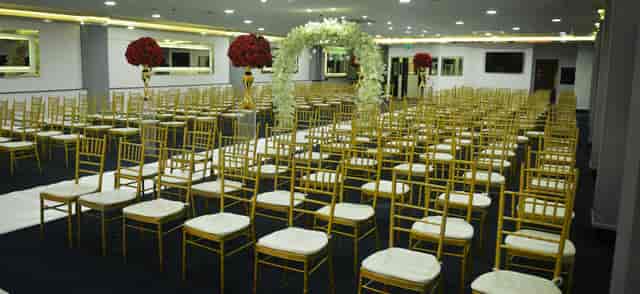 The Gulshan Suite: Elegant gold Chiavari chair ceremony setup for wedding and event hosting.