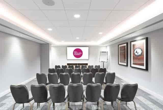 Theater-style meeting room at POLARIS BHM with AV tech for corporate workshops and presentations.