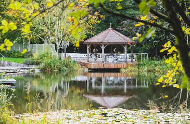 Waterside gazebo at Moddershall Oaks, ideal for outdoor wedding ceremonies and boutique receptions.