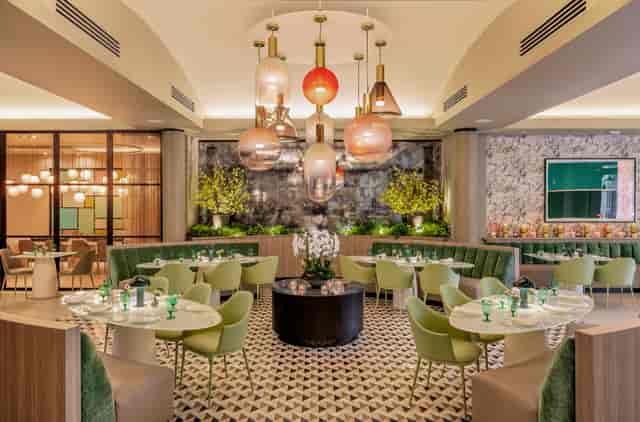 Upscale ZANA wine bar with statement lighting for corporate dinners and VIP networking events.
