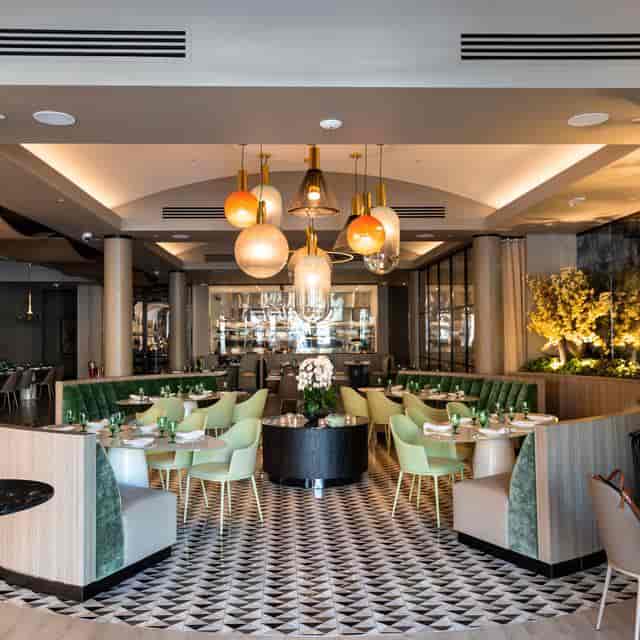 Upscale ZANA wine bar with chic banquette seating for corporate dinners and VIP networking events.