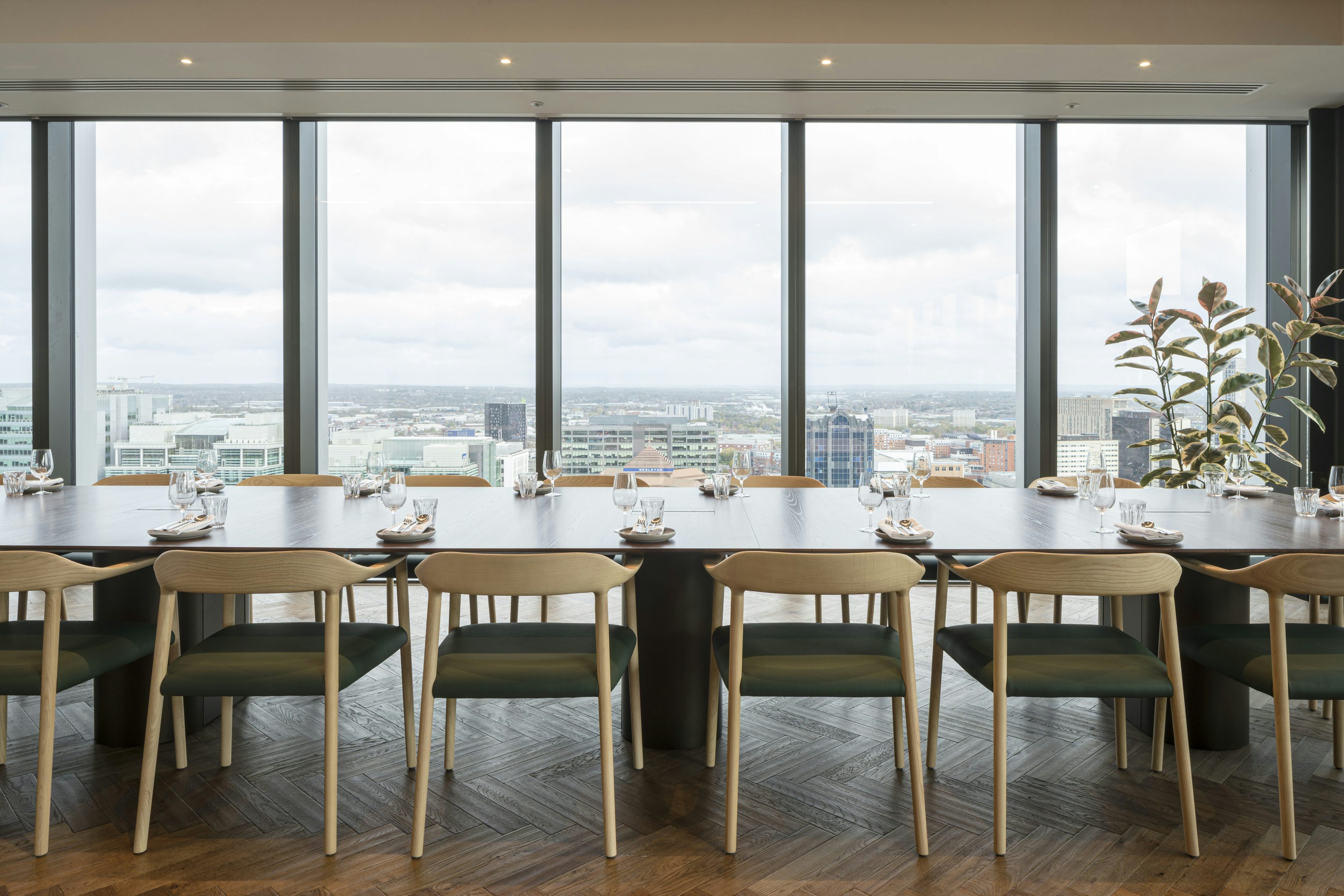 Boardroom with skyline view for corporate meetings and executive events. - Banner