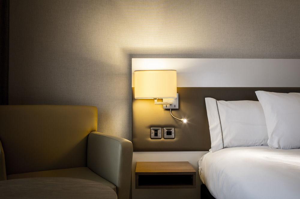 AC Hotel suite with bedside power and lighting for business conference delegates.