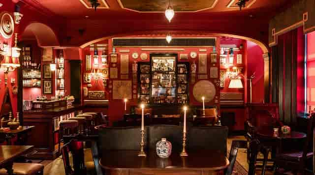 Intimate venue at The Zetter Marylebone with rich red decor for exclusive events.
