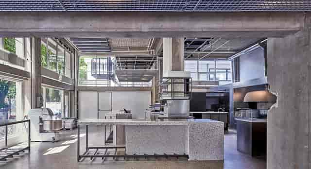 Industrial chic Old Scuola venue for high-end culinary workshops and experiential brand events.