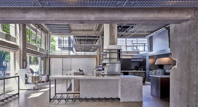 Industrial chic Old Scuola venue for high-end culinary workshops and experiential brand events.