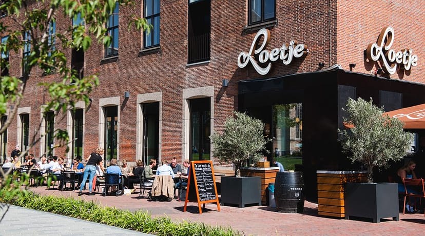 Loetje industrial brick restaurant patio, ideal for casual team lunch and networking event venue.