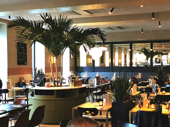 Loetje restaurant with high ceilings, ideal for professional networking mixers and corporate dinners.