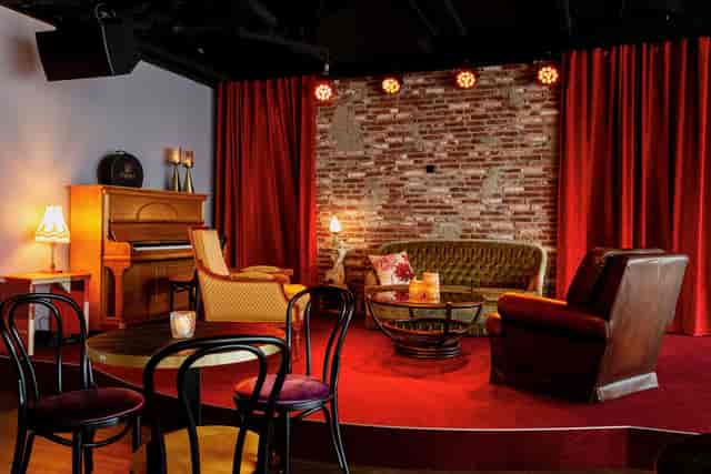 Vintage lounge at Café Dox, perfect for fireside chats and VIP networking events.