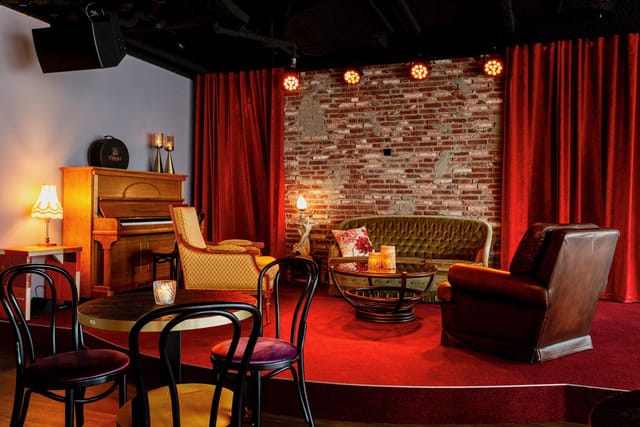Vintage lounge at Café Dox, perfect for fireside chats and VIP networking events.
