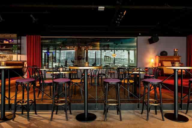 High-top lounge at Café Dox, perfect for cocktail receptions and networking events.