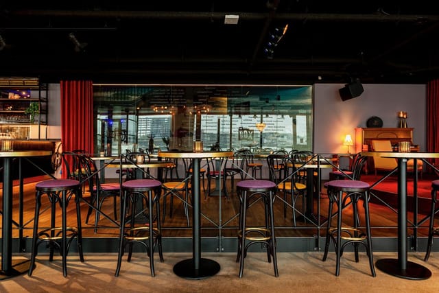High-top lounge at Café Dox, perfect for cocktail receptions and networking events.