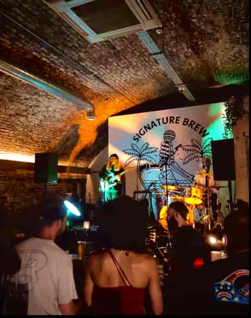 Industrial venue for experiential events with vibrant lighting and branding.