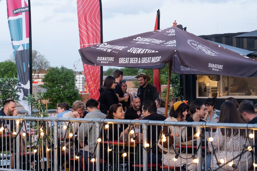 Roof terrace at Signature Brew with string lights for casual networking and corporate events.