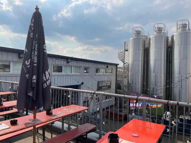 Signature Brew industrial roof terrace for corporate team building and social event venue.