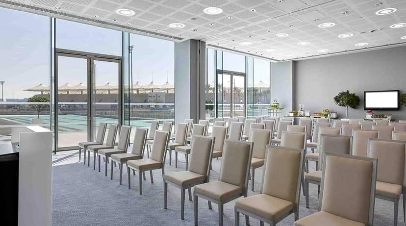 Modern event space in W Abu Dhabi with large windows for meetings and workshops.