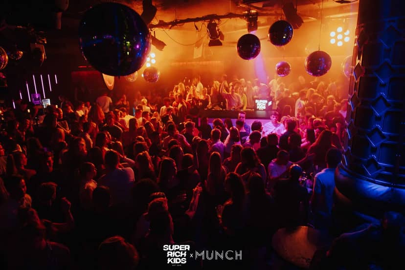 High-energy nightlife in MUNCH Rotterdam with disco ball lighting for club events and parties.
