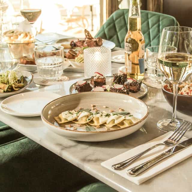 Upscale JOYA banquet dining with artisanal plating for corporate dinner and networking events.