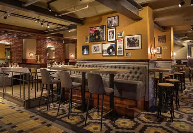 NY Basement venue at Hotel New York featuring warm, multi-level design for private events.
