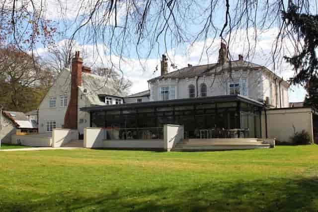 YHA York meeting room with glass-enclosed space for corporate retreats and outdoor events.