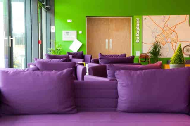 YHA York meeting room with vibrant lounge seating for networking and breakout sessions.
