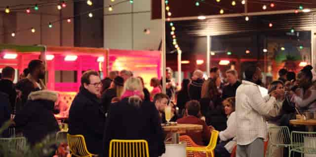 Private seating area at Turtle Bay Hammersmith during a vibrant networking event.