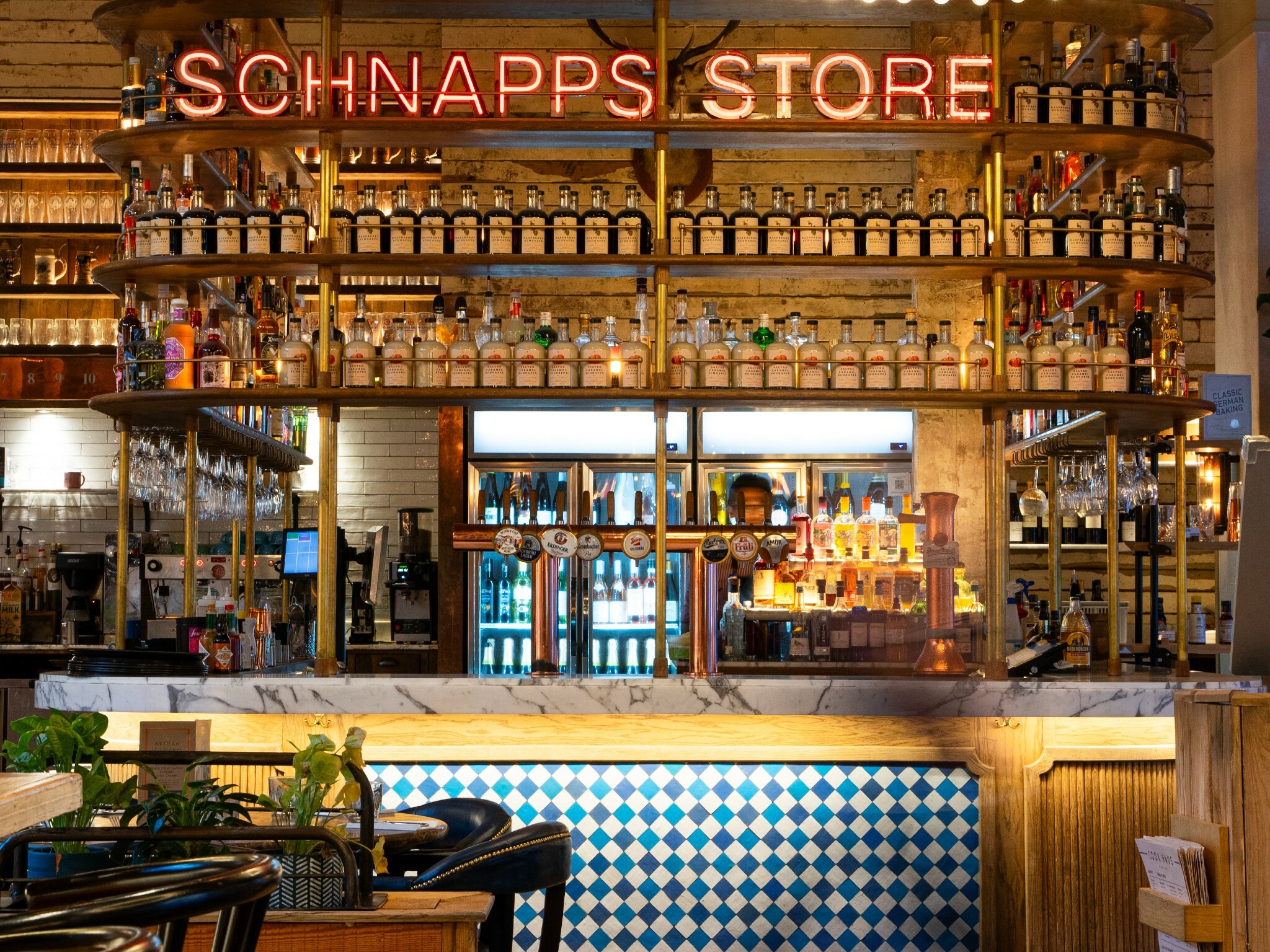 Albert's Schloss Liverpool bar interior with backlit shelving for cocktail receptions and events. - Banner